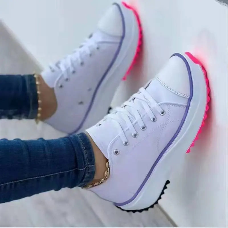 Women's white canvas low-top platform sneakers with thick cushioned sole for all-day comfort