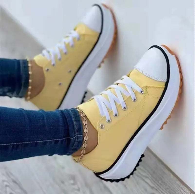 Women's white canvas low-top platform sneakers with thick cushioned sole for all-day comfort