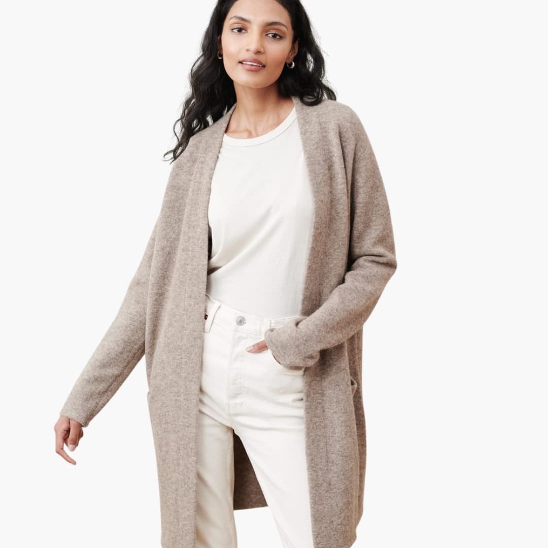 Women's open-front longline cardigan with side pockets, smooth fabric, elegant workwear silhouette