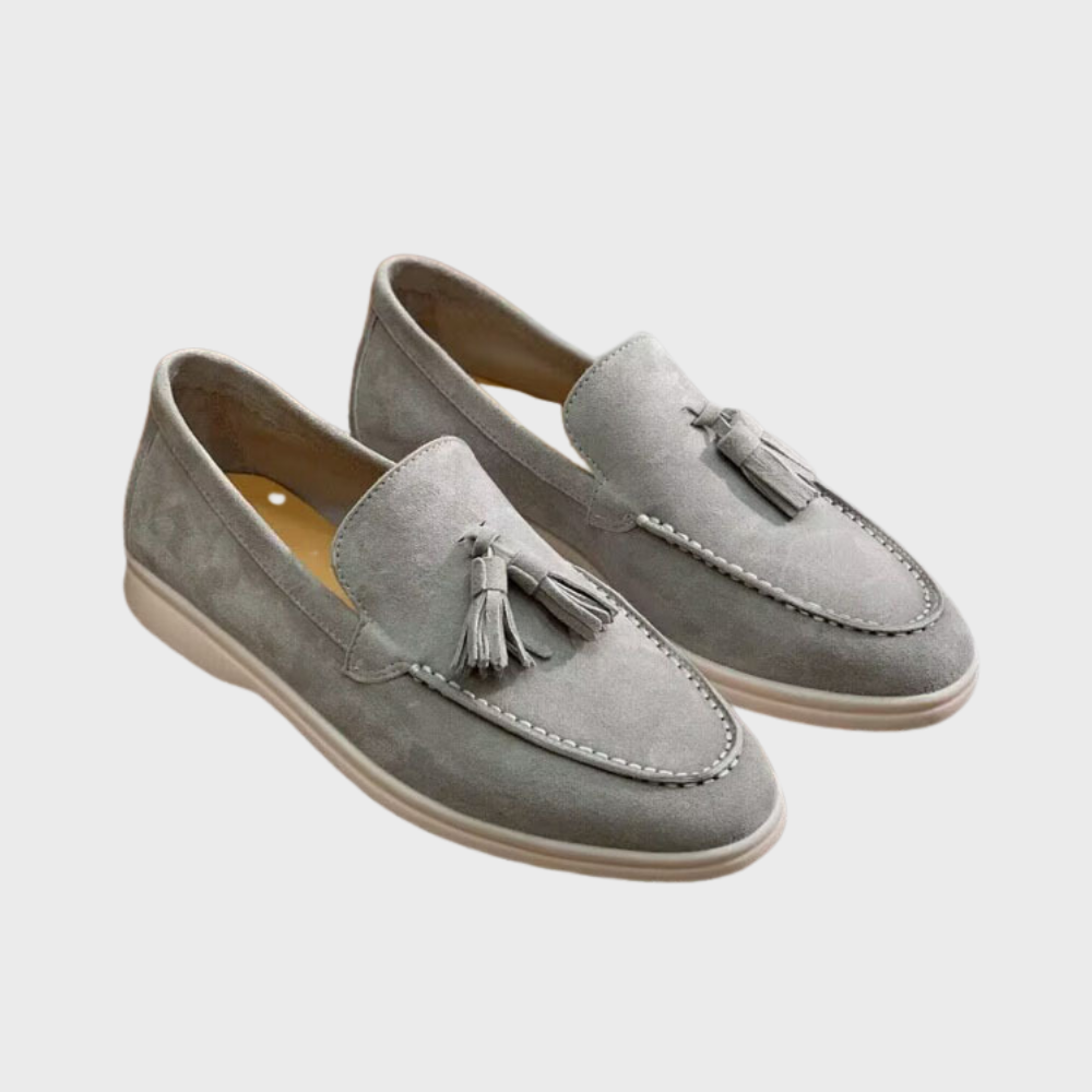 Men's black slip-on dress loafers with sleek profile and effortless professional style