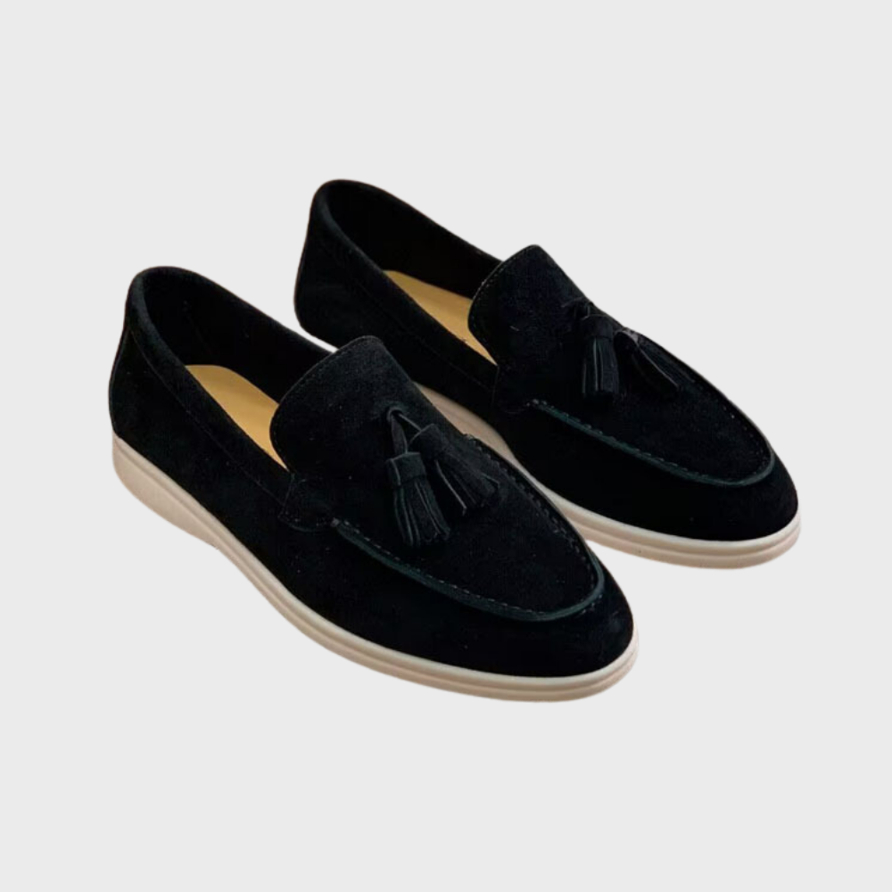 Men's black slip-on dress loafers with sleek silhouette and effortless professional style