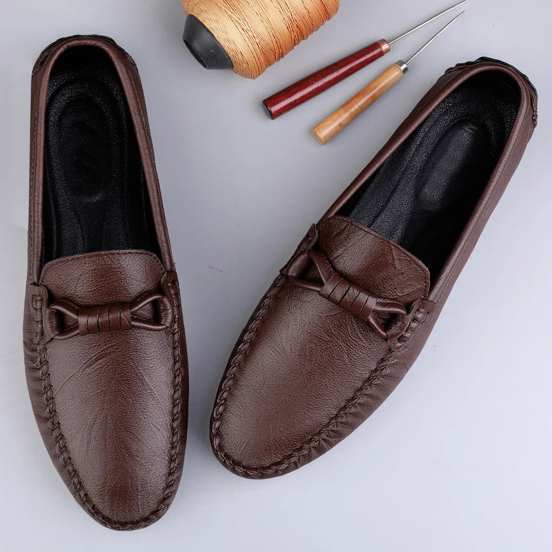 Men's brown genuine leather loafers with classic slip-on silhouette and hand-stitched detailing