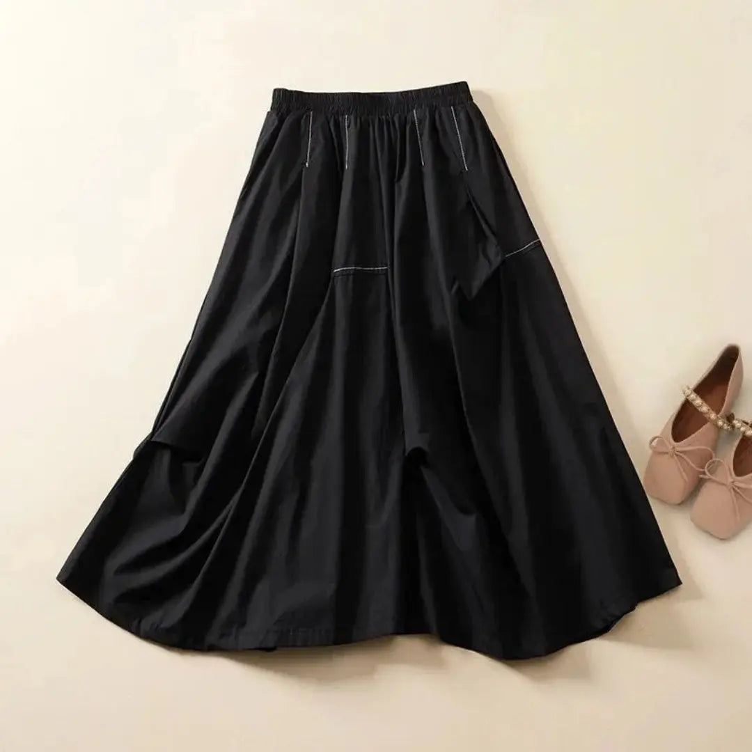 Flowy A-line maxi skirt with elastic waistband, breathable fabric, and functional side pockets
