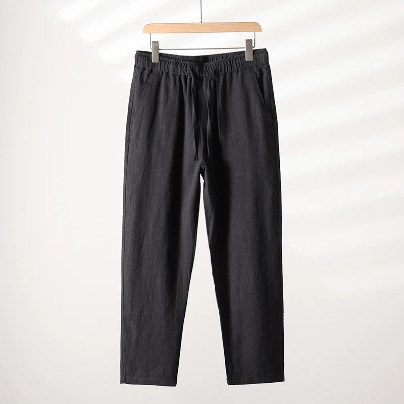Unisex tapered linen-cotton blend pants with adjustable tie waist in breathable neutral fabric
