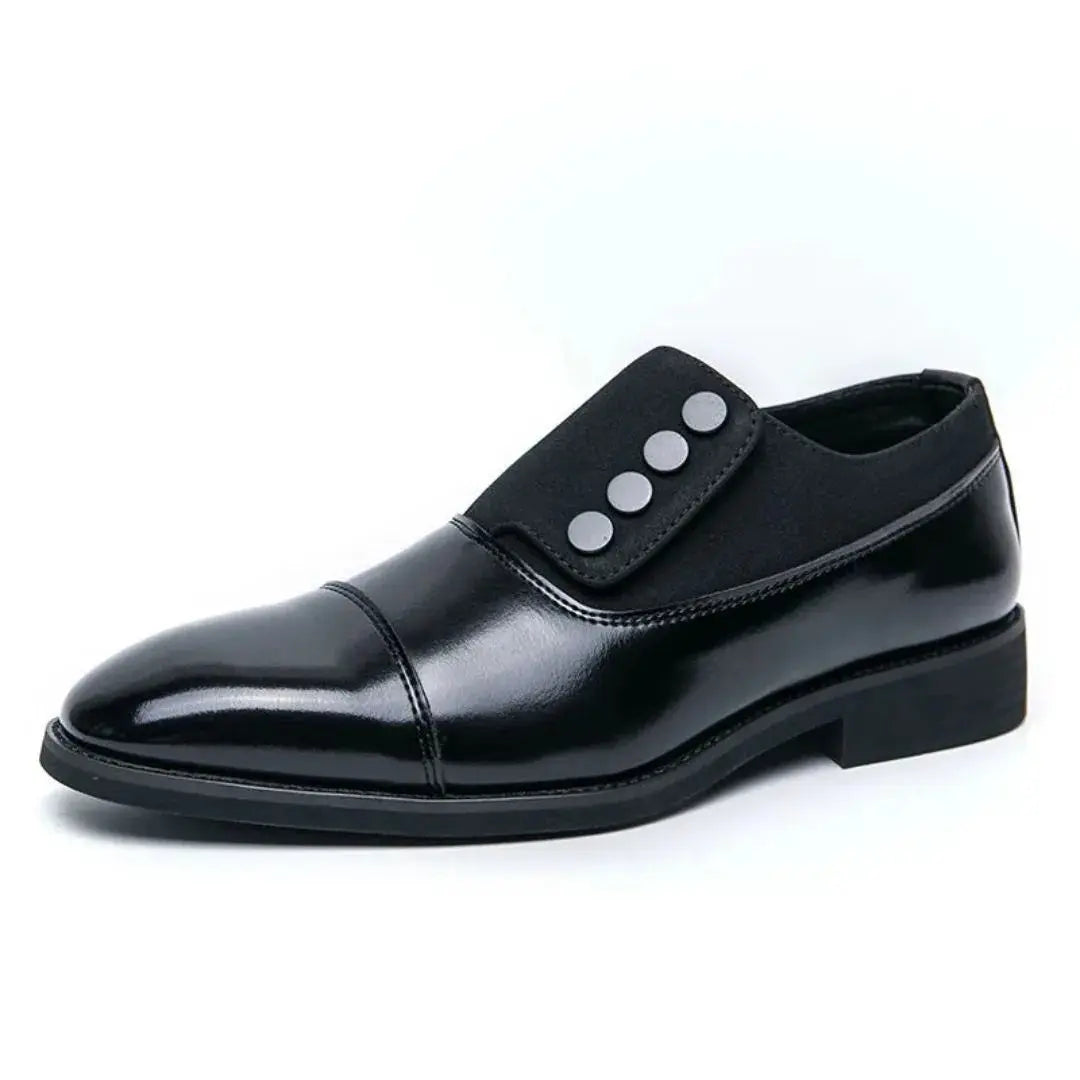 Men's two-tone oxford slip-on dress shoes with black cap toe and statement button flap detail