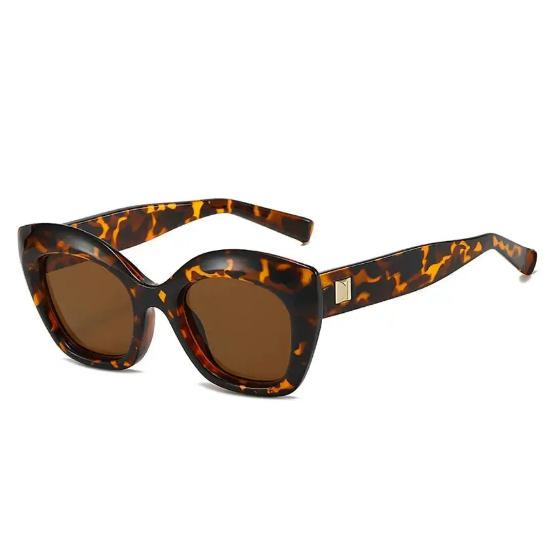 Women's bold sculpted cat-eye sunglasses with UV400 lenses, timeless feminine statement style