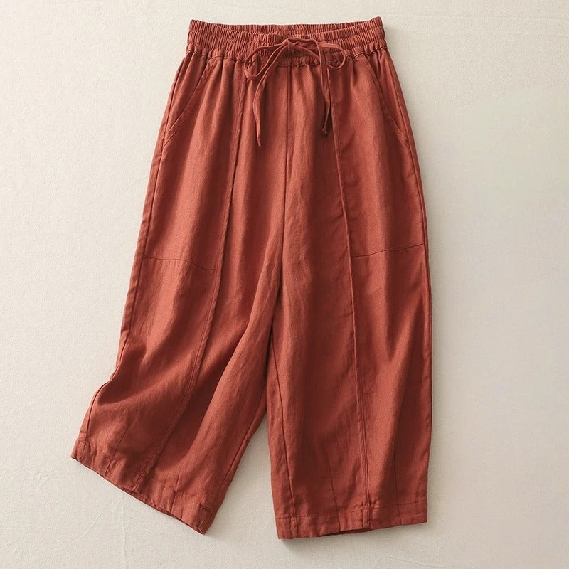 Women's cropped linen blend pants in neutral tone with elastic waist soft pleats and relaxed silhouette