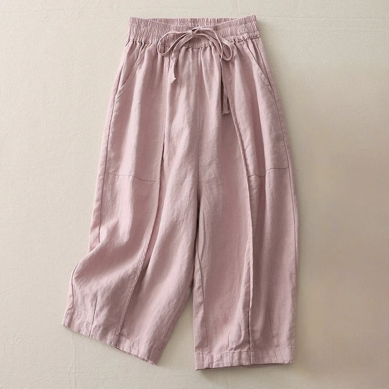 Women's cropped linen blend pants in neutral tone, relaxed fit with elastic waist and soft pleats