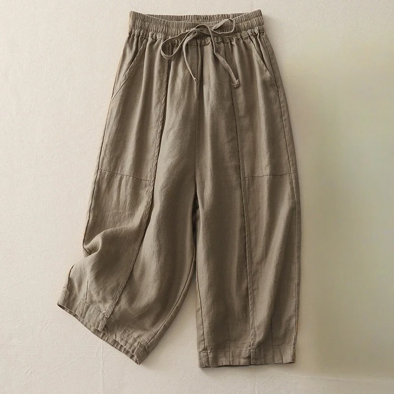 Women's cropped linen blend pants in neutral tone, relaxed silhouette with elastic drawstring waist and soft pleats