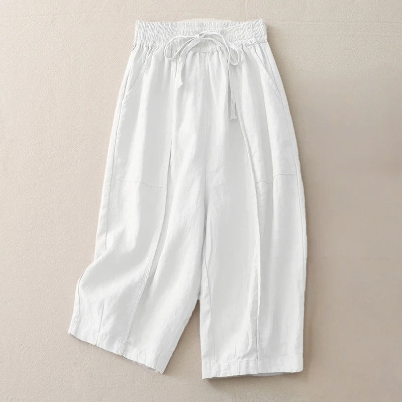 Women's cropped linen blend pants in neutral tone, relaxed silhouette with elastic waist and soft pleats