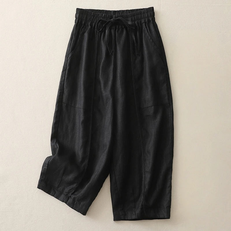 Women's cropped linen blend pants in neutral tone, relaxed silhouette with elastic drawstring waist and soft pleats