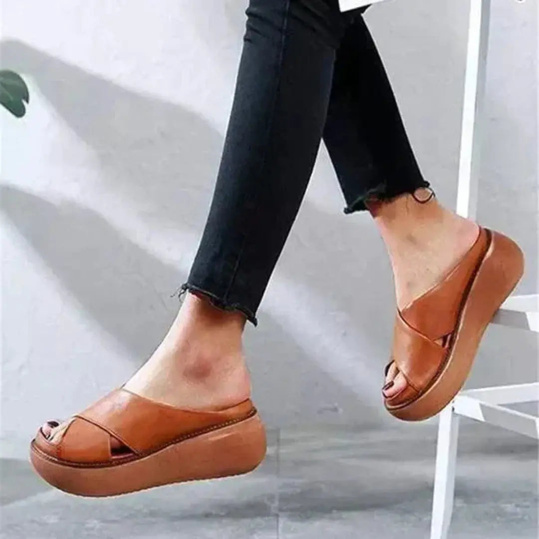 Women's beige cross-strap platform sandals with cushioned footbed and open-toe X-strap design