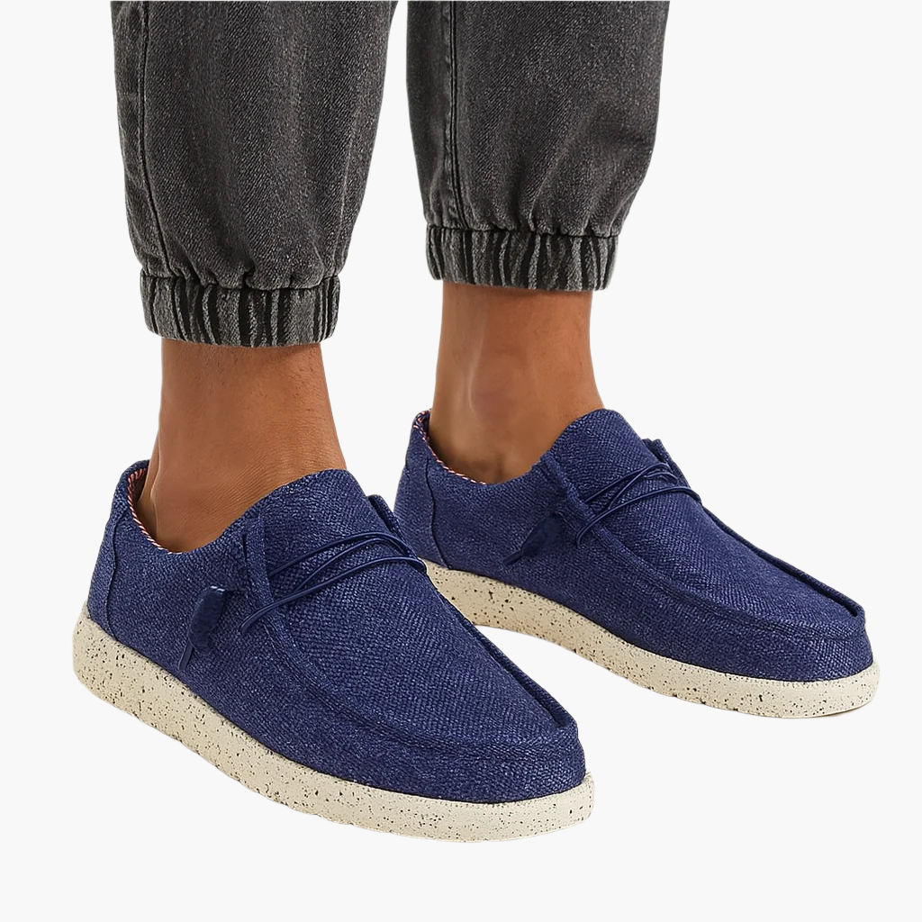 Men's canvas slip-on loafers in neutral tone, modern silhouette with clean lines for everyday casual wear