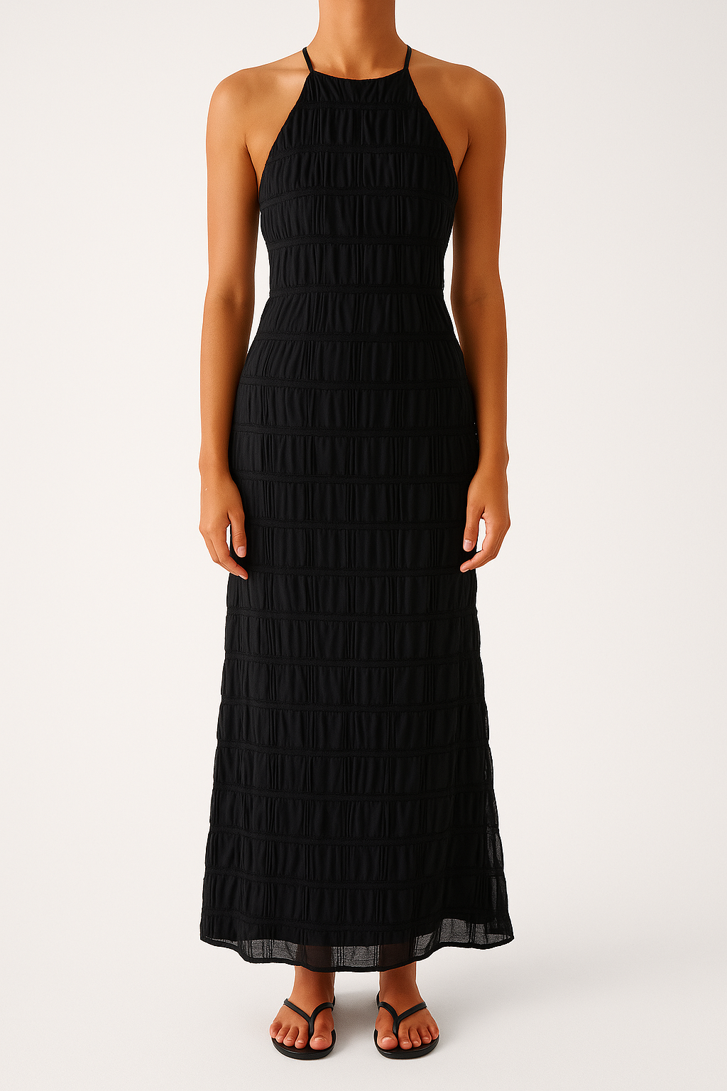 Women's fitted halterneck maxi dress with ruched texture and elegant open back for evening occasions