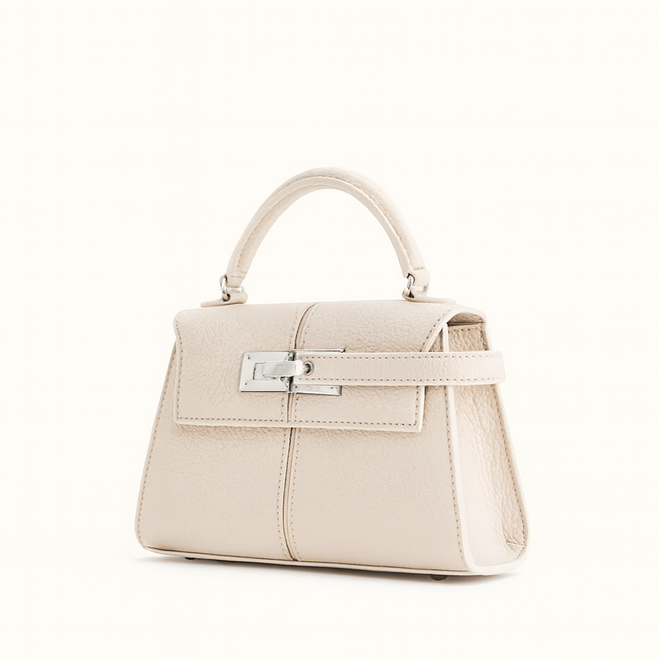 Structured mini leather crossbody bag in neutral tone with clean silhouette and versatile strap