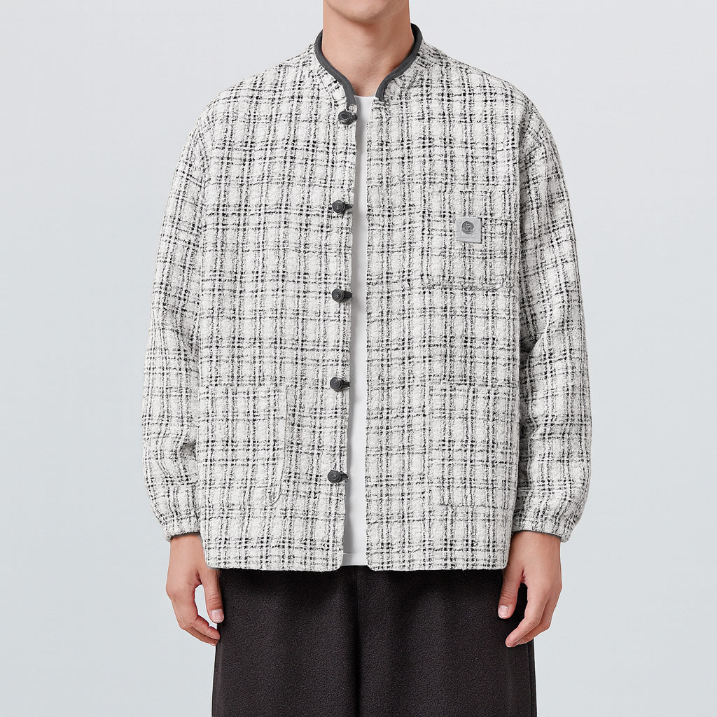 Beige tweed boxy jacket with East Asian-inspired pankou knot closures and structured silhouette