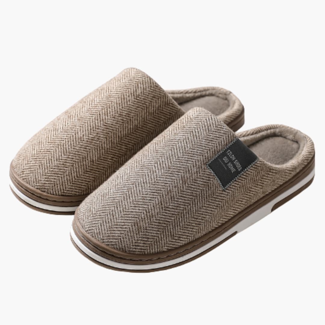 Men's slip-on indoor slippers with soft inner lining, non-slip sole, and smooth textile exterior