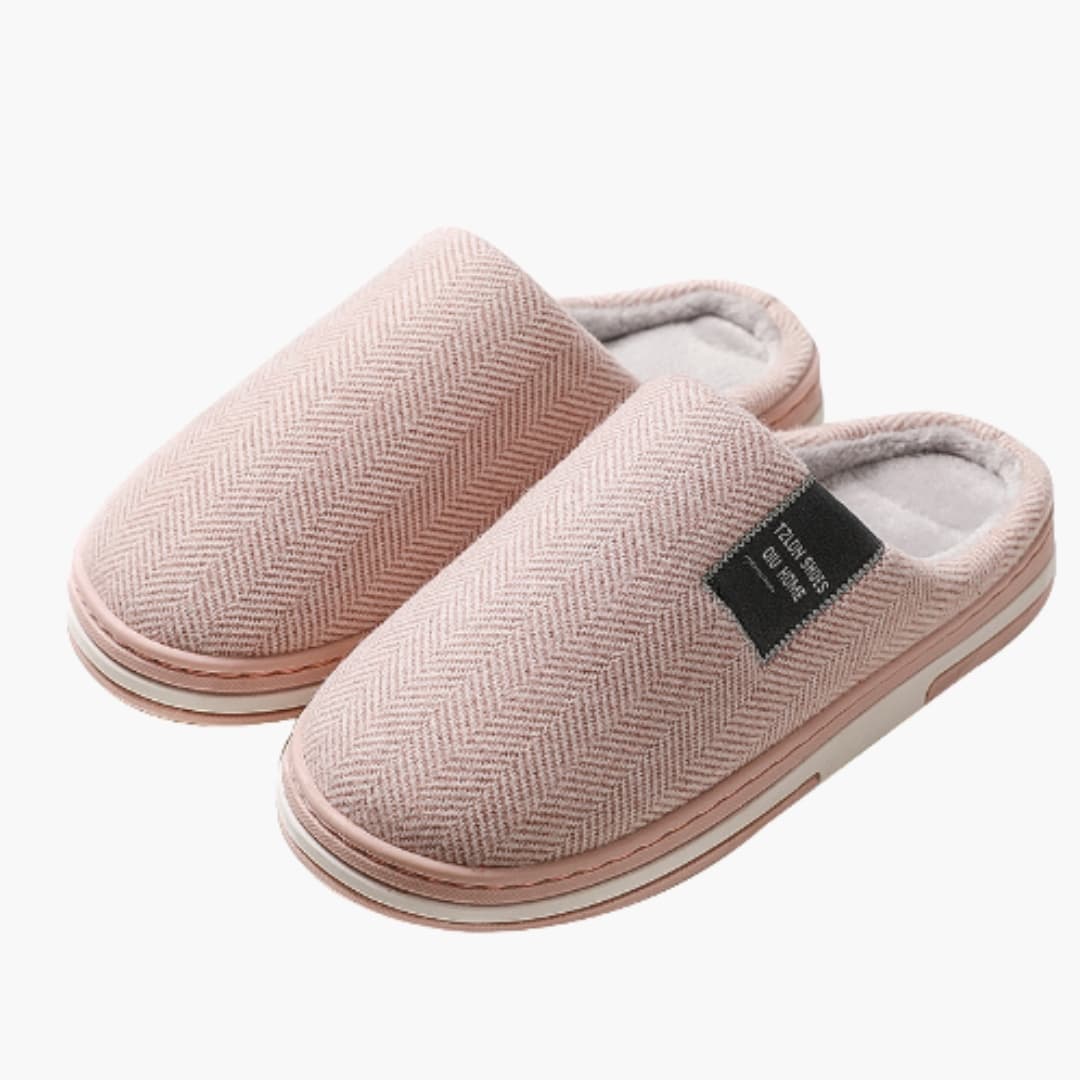 Men's slip-on indoor slippers with soft inner lining, non-slip sole, and textile exterior