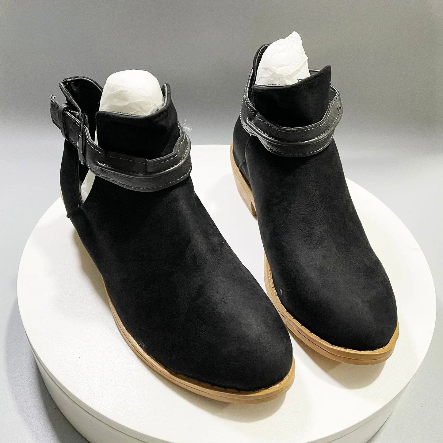 Women's chic pointed-toe ankle boots with adjustable buckle strap in elegant neutral tones
