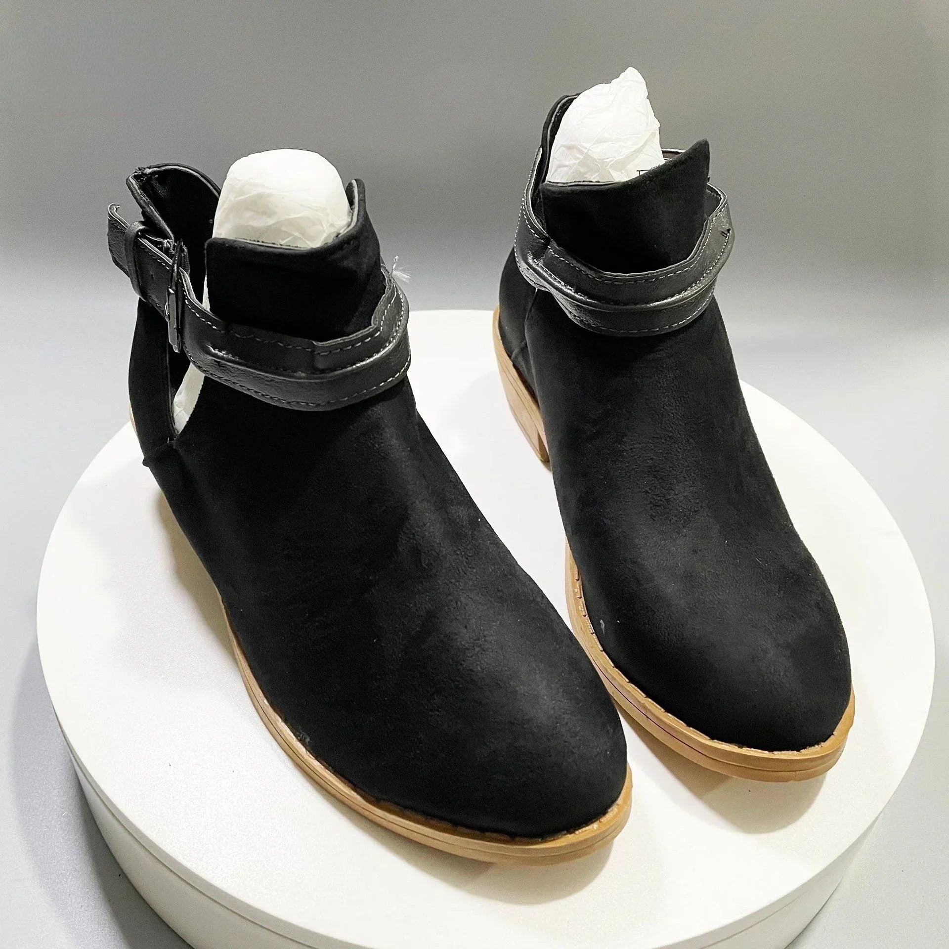 Women's chic pointed-toe ankle boots with adjustable buckle strap in elegant neutral tones