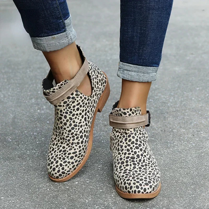 Women's chic pointed-toe ankle boots with adjustable buckle strap in elegant neutral tone