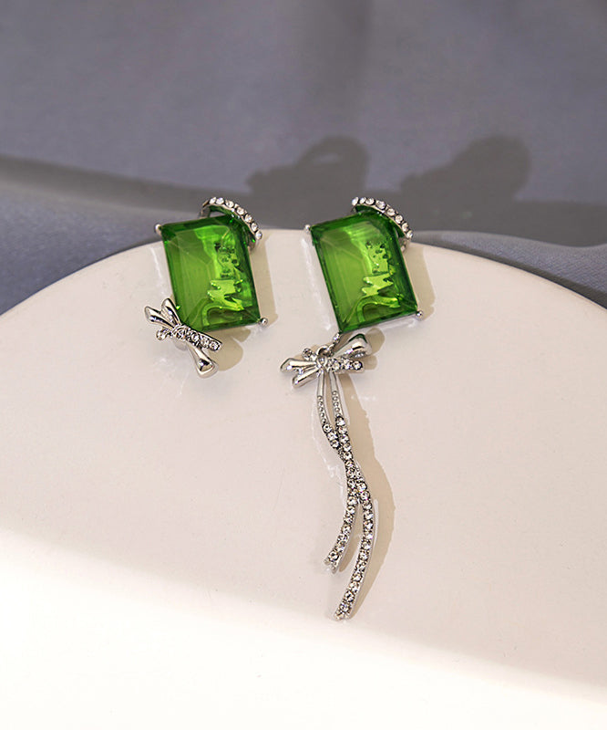 Boucles d'oreilles pendantes chics asymétriques en cuivre vert et zircon, avec nœud papillon et pompon - Urbann-Vibe
