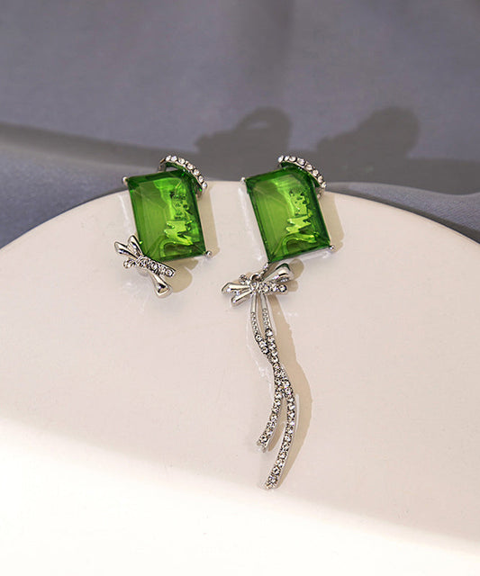 Boucles d'oreilles pendantes chics asymétriques en cuivre vert et zircon, avec nœud papillon et pompon - Urbann-Vibe