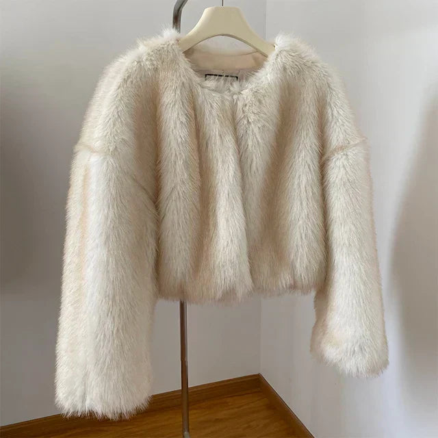 Women's quilted fur jacket elegant silhouette in neutral tone with luxurious timeless outerwear design