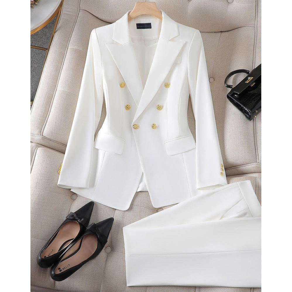 Rose two-piece blazer trouser suit with sharp lapels and gold closures for professional women
