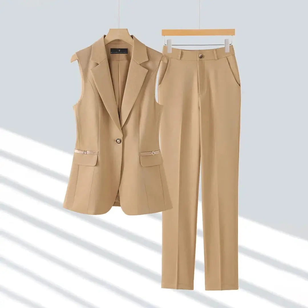 Women's navy blue sleeveless blazer and straight-leg trousers pantsuit set with polished button detail