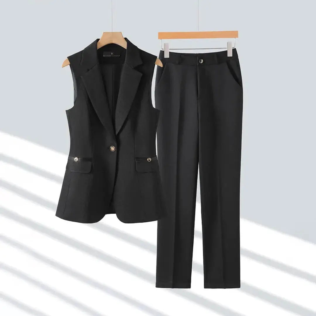 Women's sleeveless blazer pantsuit set in professional straight-leg cut with polished button detail