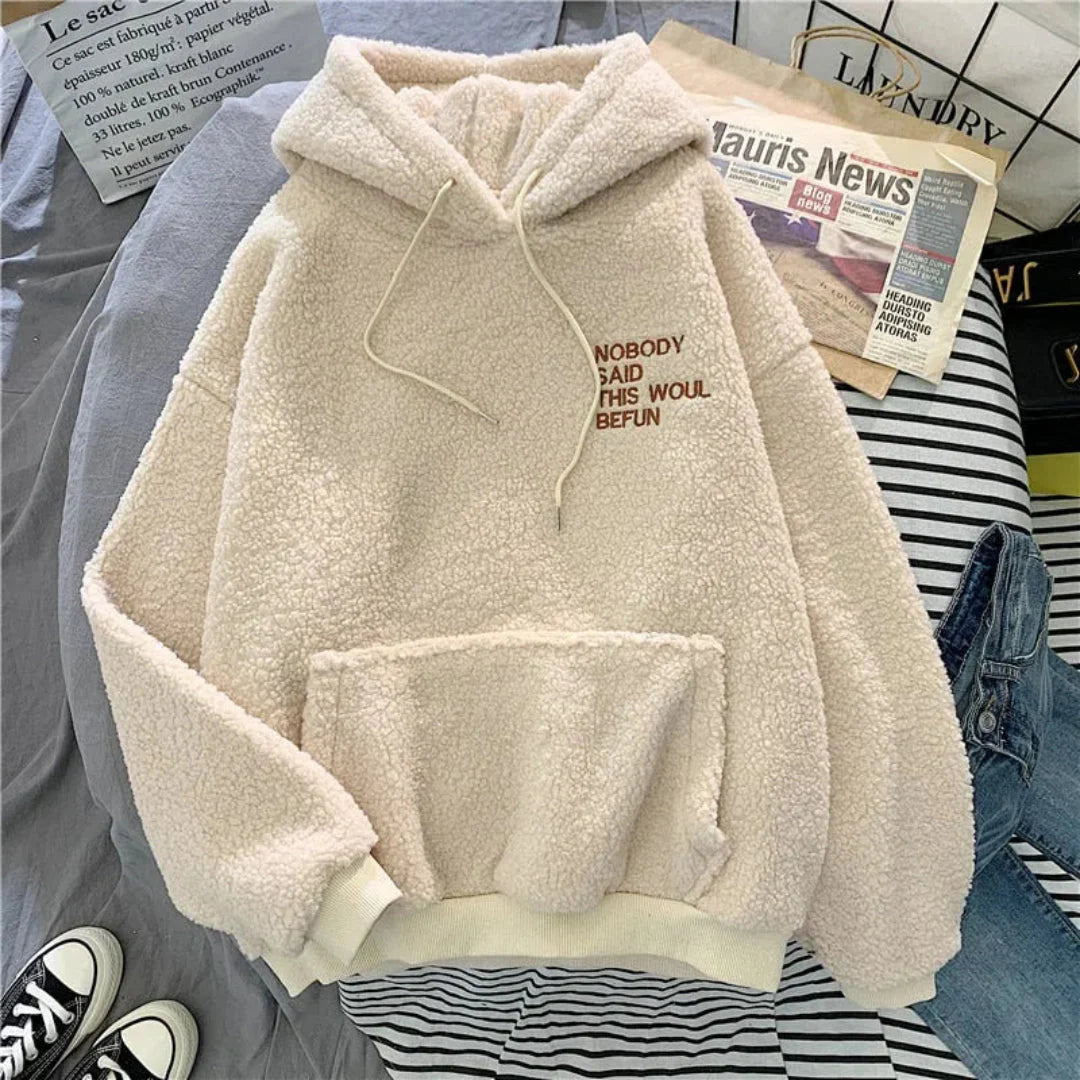 Women's oversized fleece hoodie in neutral tones with embroidered detail, cozy relaxed fit