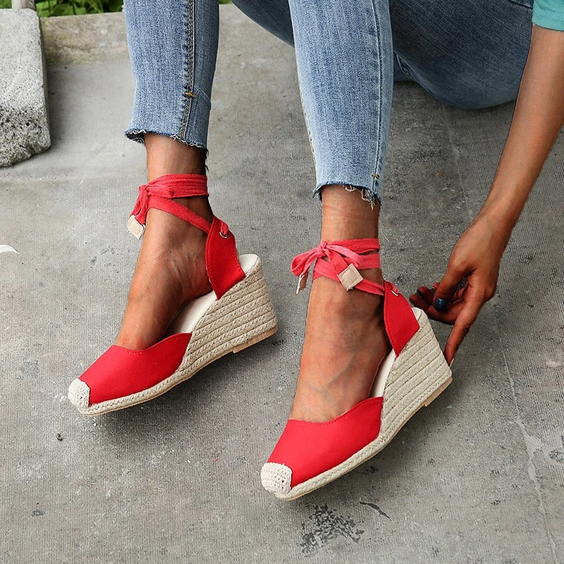 Women's closed-toe white canvas wedge sandals with braided jute heel and all-day comfort