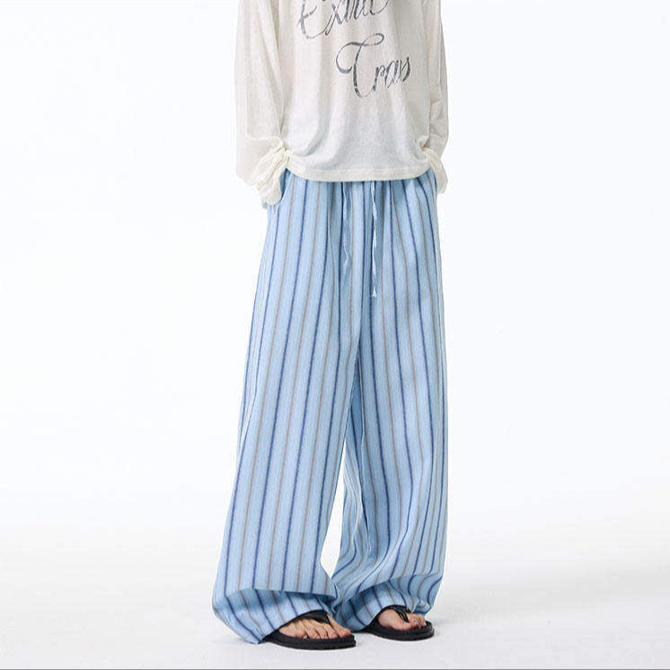 Light gray striped ultra wide leg sweatpants with vertical pattern, relaxed French Riviera casual fit