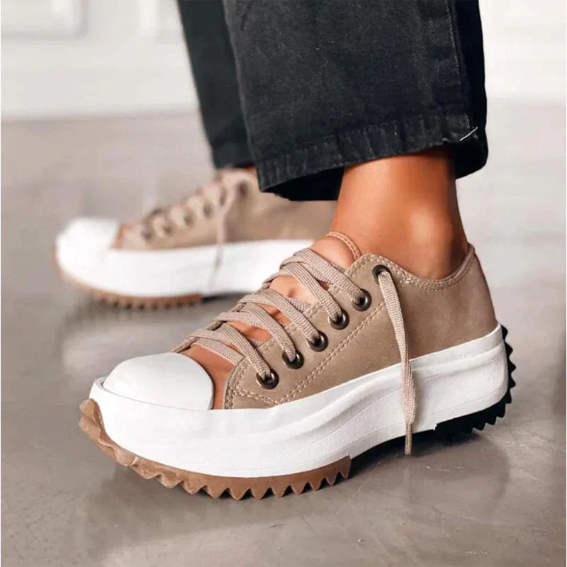 Women's white lace-up platform sneakers with chunky lug sole, low-cut silhouette for everyday style
