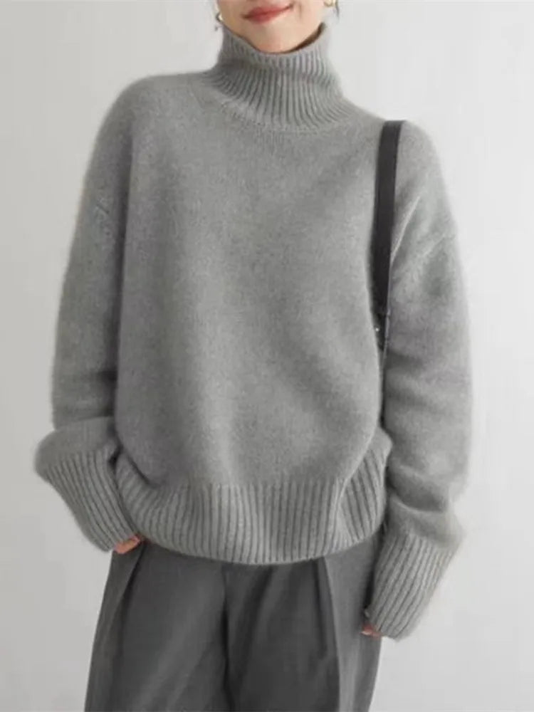 Women's wool turtleneck sweater in elegant classic knit with cozy ribbed collar for timeless style