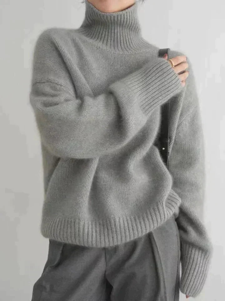 Women's oversized turtleneck wool knit sweater dropped shoulders ribbed hem cozy fall winter style
