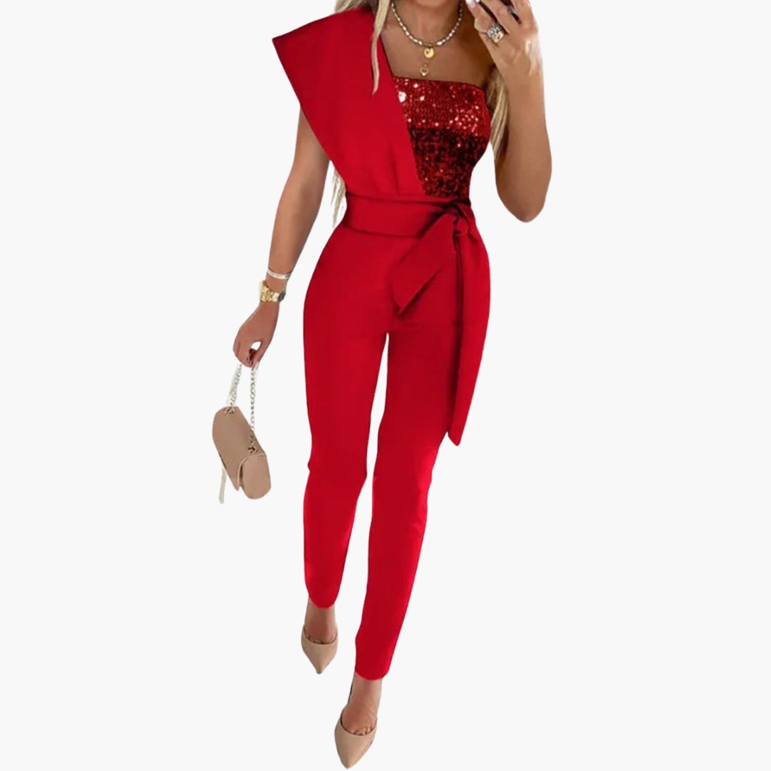 Women's silver sequin one-shoulder jumpsuit with wide belt, tapered legs, and asymmetrical neckline