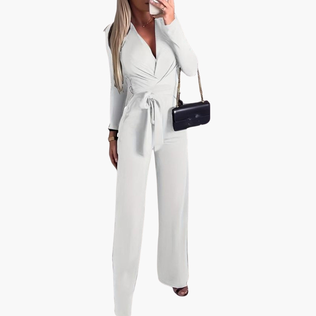 Women's wide-leg jumpsuit in solid color with wrap neckline, tie waist, and long sleeves for chic everyday style