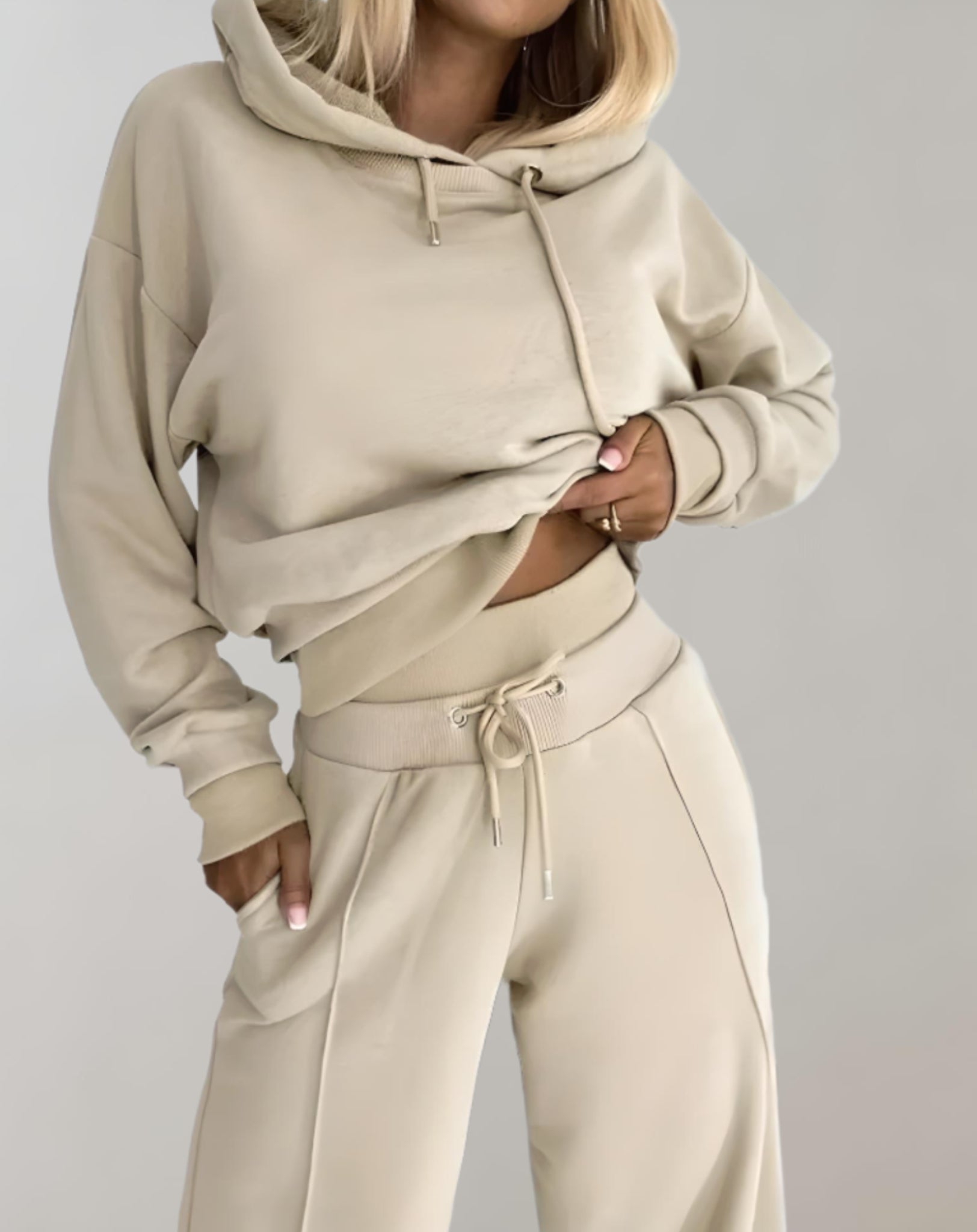 Women's casual hoodie tracksuit set in matching two-piece relaxed fit with drawstring pants