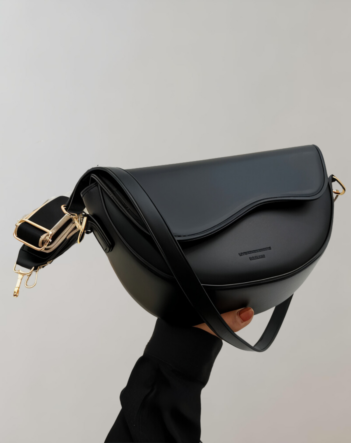 Emma elegant black vegan leather half-moon crossbody bag compact sleek women's daily essential