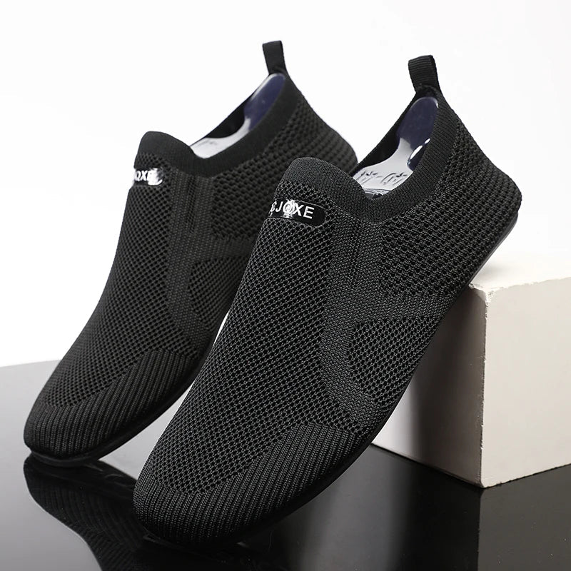 Men's gray mesh slip-on loafer with breathable stretch-knit upper and ultra-light sole