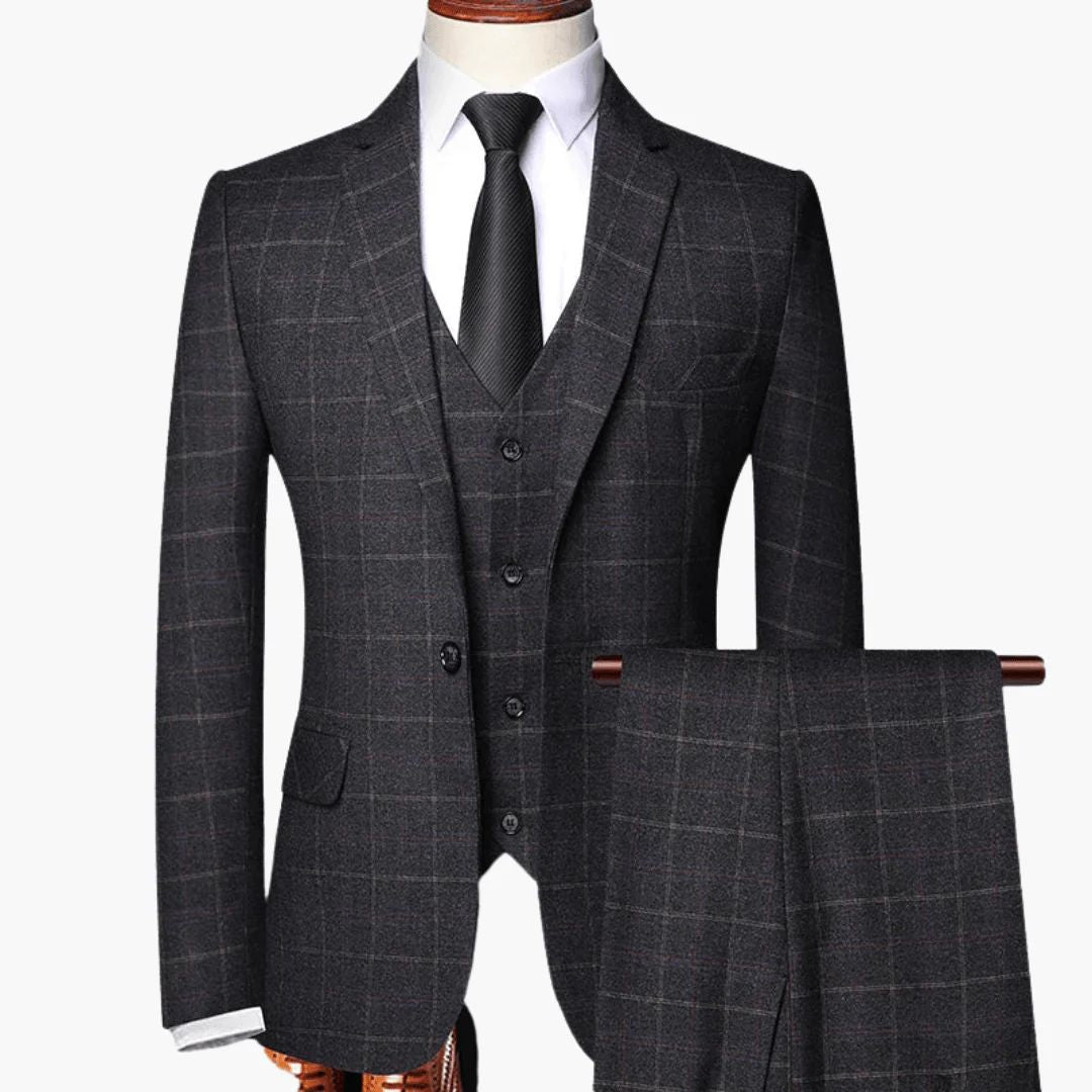 Men's navy plaid three-piece suit with buttoned vest, classic check pattern, elegant tailored fit