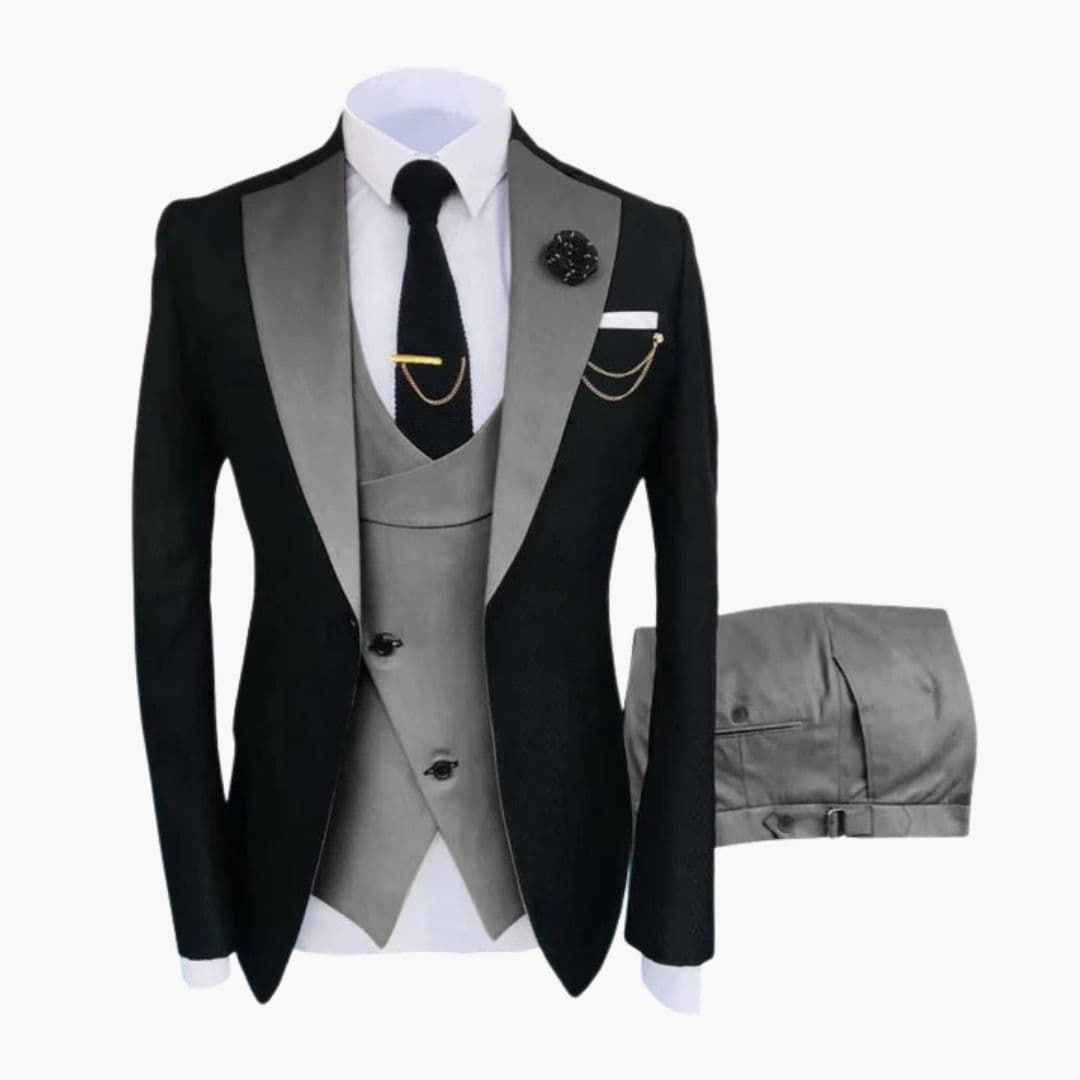 Men's black three-piece ceremonial suit with contrasting collar, buttoned vest, and chain accents