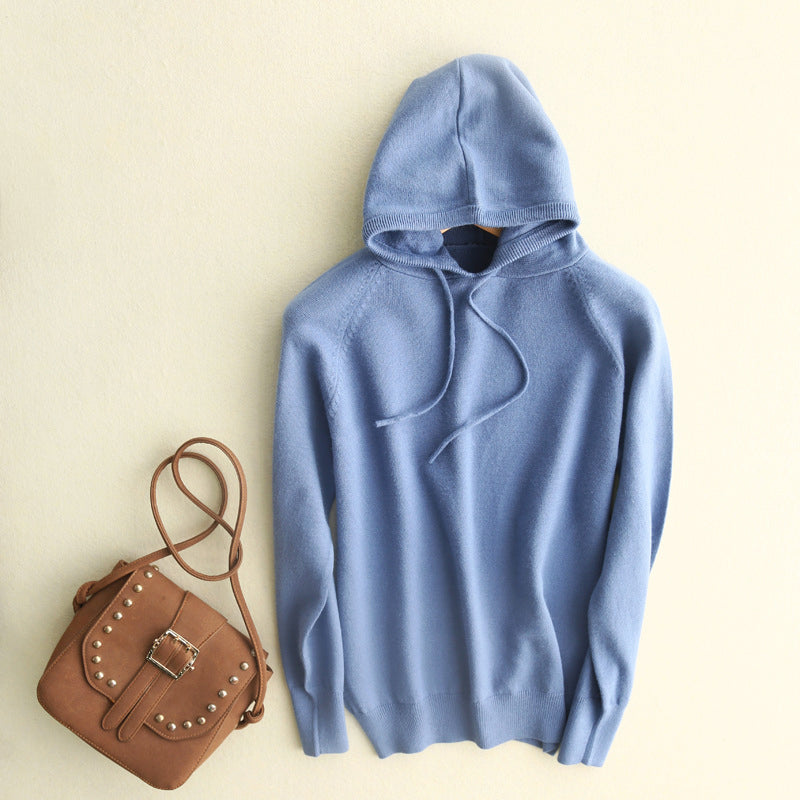 Lightweight soft knit hoodie in neutral tone with fine-knit texture and fluid drape for minimalist style