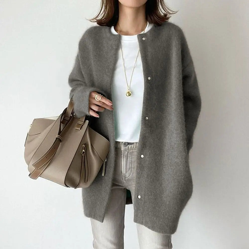 Women's relaxed-fit wool cardigan with suede accents, cozy pockets, and modern chic style