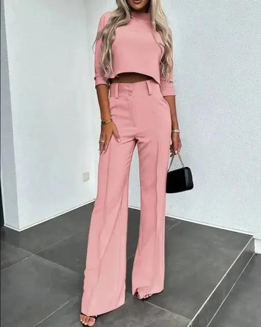 Women's black cropped top and high-rise trousers co-ord set with minimalist two-piece design