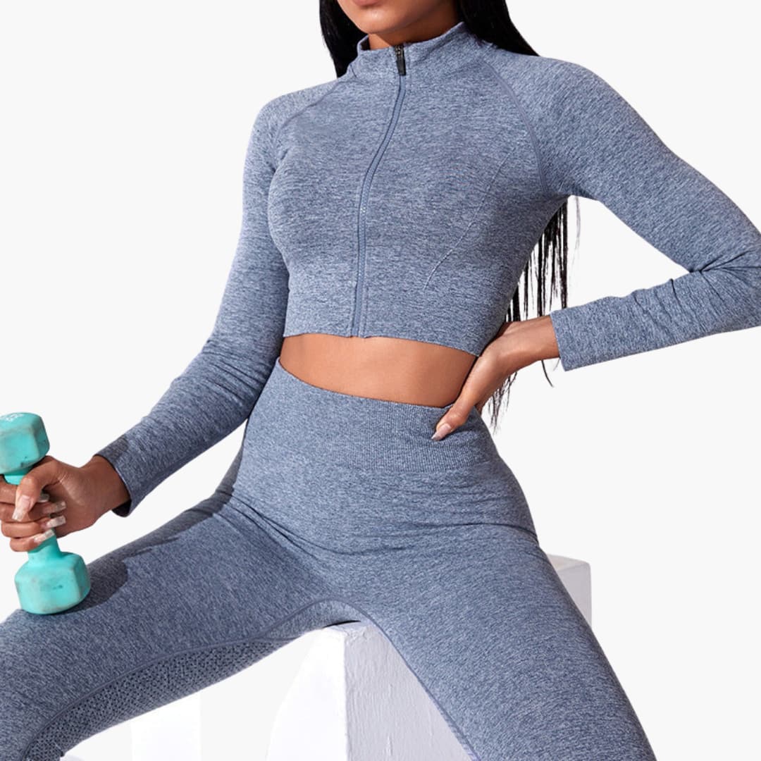Women's fitted sleeveless crop top in high neck design with front zip closure for workouts