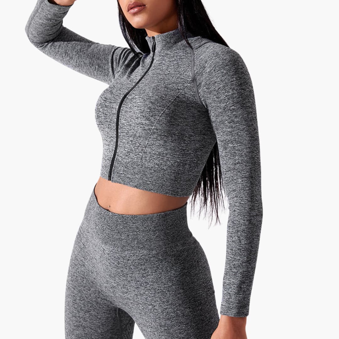 Women's black sleeveless crop top fitted high neck front zip athletic style for gym