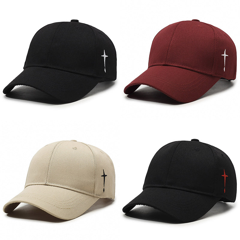 Washed cotton baseball cap with bold cross embroidery, curved brim, adjustable street-style fit